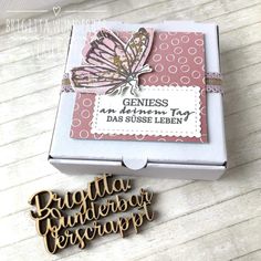 a box that has some type of paper on it with the words, and a butterfly