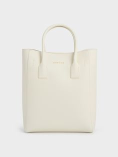 Presenting a capacious tote that features a minimalist design and comes with a printed scarf. In a chalk-white colourway, it offers versatility in spades. Carry it by the double top handles or with the adjustable bag strap to go hands-free. Bonus points for the detachable pouch that can be used to keep your coins, lipstick or keys organised and secure. Adjustable Bag Strap, Adjustable Bag, Printed Scarf, Key Organizer, Size Chart For Kids, Charts For Kids, Chalk White, Charles Keith, Printables Kids