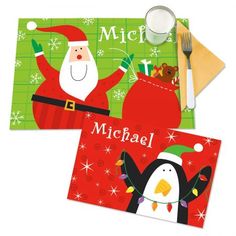 two christmas cards with santa and penguin on them