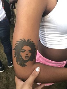 a woman with a tattoo on her arm