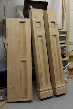 two unfinished wooden doors sitting next to each other