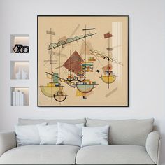 an abstract painting hangs on the wall above a couch in a living room with white walls