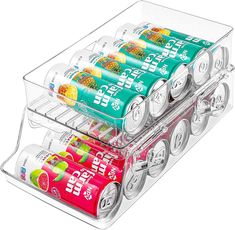 three tiered trays filled with soda cans and fruit juice in various flavors, all stacked on top of each other