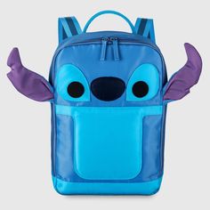 a blue backpack with purple wings on the front and back pocket, which has two small eyes