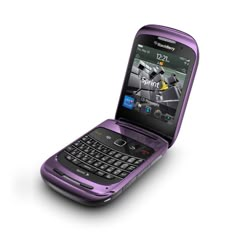 a purple cell phone sitting on top of a white surface