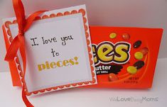 an orange and white card with a candy bar saying i love you to pieces on it