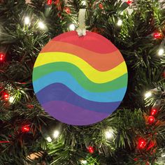 a colorful ornament hanging from a christmas tree