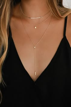 The Lulus Coretta Layered Gold Necklace is here to make your outfit perfect! Three layers of dainty gold chains, embellished with a row of round charms, a circle charm, and a drop chain embellished with a single rhinestone and bar charm, all come together to create a simple yet sweet look. Lobster Clasp Closure. Shortest Chain Measures 13. 5" Long. Longest Chain Measures 16. 5" Long With A 3" Extender Chain. Drop Measures 4". Man Made Materials. Imported. Lulus | Coretta Layered Gold Necklace. Layered Gold Necklace, Layer Necklaces, Gold Outfit, Body Chains, Costume Jewelry Necklaces, Gold Necklace Layered, Girly Jewelry, Accessories Jewelry Necklace, Short Necklace