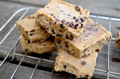 chocolate chip cookie bars stacked on top of each other in front of a cooling rack