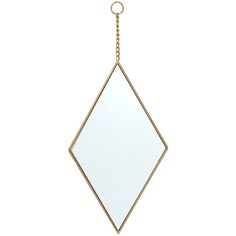 a white and gold diamond shaped mirror hanging from a chain