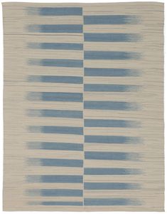 a blue and white rug with horizontal stripes