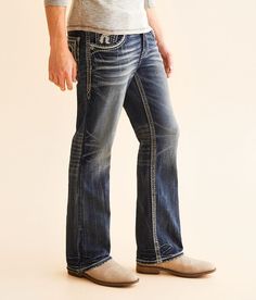 Rock Revival Ziggy Slim Boot Stretch Jean - Blue 25/30, Men's Ziggysb205 Slim fit bootcut jean Comfort stretch fabric Low rise 18 bottom opening Embroidered blowout back pockets Hand sanding whiskering grinding and veining details Zip fly. This quality denim is hand-finished for a unique look. It will wear like your favorite jeans, with each hole and tear continuing to destruct over time. You will love the comfort of this denim that has the look and feel of years of wear. . 99% Cotton 1% Elastane. Machine wash separately cold water inside out. Do not bleach. Tumble dry low. Remove promptly. Warm iron if needed. Apparel & Accessories > Clothing > Pants Bootcut Jean, Clothing Pants, Accessories Clothing, Rock Revival, Favorite Jeans, Stretch Jeans, Bootcut Jeans, The Rock, Men's Jeans