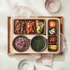 an overhead view of a bento box filled with food