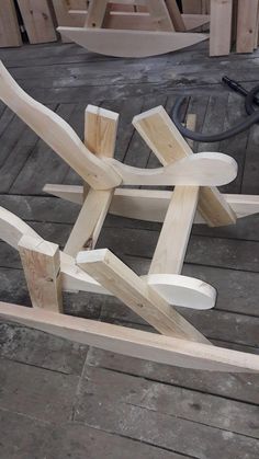 a wooden chair sitting on top of a wooden floor