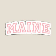 the word maine in pink and white sticker on a beige background with an orange stripe