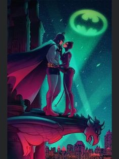 batman and catwoman kissing in front of the city at night with green light behind them