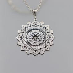 ★Item Details * Gender: Male / Female * Material:  925 Sterling Silver * Finish: Polished  * Chain : 925 Sterling Silver * Shipping: 2-5 days  * Handmade * Personalization: YES This unique silver necklace features a detailed design with three layers of 8 circles each, framed within an elegant lotus flower. Each petal of the lotus contains a circle, with an additional 8 circles in the center, and 8 more at the core. This intricate and meaningful design symbolizes harmony, balance, and spiritual a Silver Etched Necklace With Flower Pendant, Silver Engraved Necklace For Meditation, Sterling Silver Engraved Necklaces For Meditation, Spiritual Engraved White Gold Jewelry, Silver Amulet Necklace With Flower Pendant, Engraved Spiritual White Gold Jewelry, Spiritual White Gold Jewelry With Large Pendant, Engraved White Gold Spiritual Jewelry, Spiritual Engraved Flower Pendant Jewelry