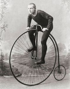 an old time photo of a man on a penny - wheel bicycle with no wheels