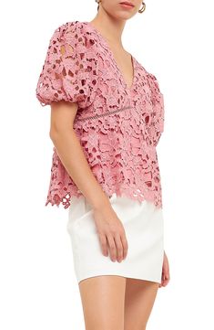 Full of romantic charm, this floral-lace top features puff sleeves and a flouncy finish. V-neck Short sleeves Lined 100% polyester Hand wash, dry flat Imported Feminine Lace V-neck Top, Feminine Lace Top For Brunch, V-neck Lace Top With Scalloped Detail, Feminine Blouse With Lace Sleeves And V-neck, Elegant V-neck Lace Top For Brunch, Spring V-neck Top With Scalloped Lace, Pink Ruffled Lace Top, Pink Lace Top With Ruffles, Feminine V-neck Top With Lace Sleeves