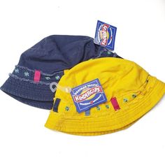 Two Bucket Hats For Little Girs, One Bright Yellow, One Navy Blue. Screen Printed Flower Print, Raw Edge Detail. Nwt Kindercaps Bucket Hat Fisherman 2pc Pair 2-6x Blue Yellow Girls Summer Sun New Y2k 90s Retro Toddler Bucket Hat, Yellow Girls, Toddler Sun Hat, Pink Tye Dye, Kids Sun Hat, Pink Baseball Cap, New Y2k, Patagonia Kids, Toddler Winter