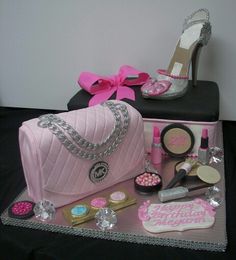 a cake that is sitting on top of a table with shoes and other items around it