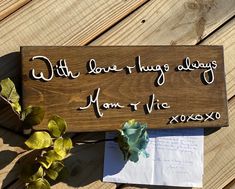 a wooden sign sitting on top of a wooden table