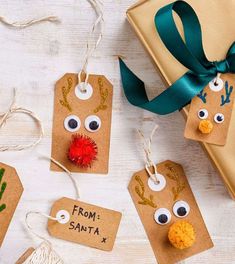 three christmas gift tags with fake reindeer noses on them