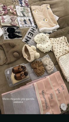 there are many items on the bed to be used for making baby shoes and scarves