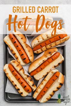 grilled carrot hot dogs in buns on a tray with text overlay that reads grilled carrot hot dogs