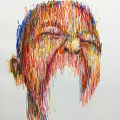 a drawing of a man's face made out of colored crayons