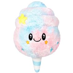 a pink and blue ice cream cone with stars on it's top, sitting in front of a white background