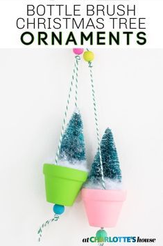 two christmas tree ornaments hanging on a wall with text overlay that says bottle brush christmas tree ornaments