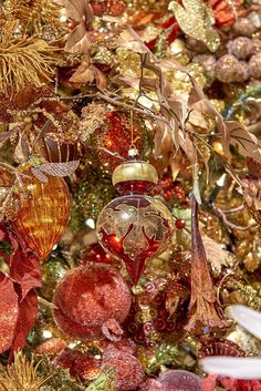 a christmas tree with ornaments hanging from it's branches