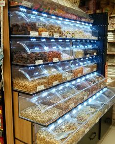 a store filled with lots of different types of food and snacks on display in bins