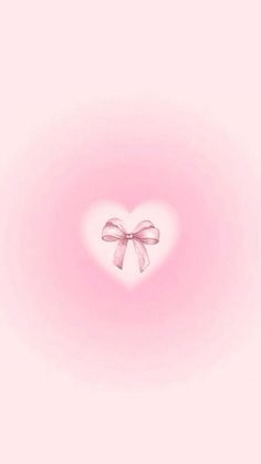 a pink background with a heart shaped bow