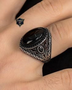 "Byzantine Chain Design Ring, Turkish Silver Ring, Men's Black Onyx Silver Ring, Handmade Gemstone Ring, 925 Sterling Silver, Gift for Men ✦ Details ✦ * Material: 925 Sterling Silver * Gemstone: Onyx * Weight: 12.00 grams * The size of the stone: 15x20 mm. * Sides oxidized, decorated with Garnet stones and Micro Zircon stones. * Stamp: 925 * Available sizes; 5 US to 16 US. Contact me if you need any other size! ✦ Shipping ✦ * Processing time: 1-3 business days. * This item ships from my Turkish workshop in Istanbul. * Add your phone number in address box for a smoother delivery. That makes courier personnel's job easier.  ✦ Packaging ✦ * Comes with a luxury gift box and a jewellery cleaning cloth and courtesy gift. ✦ Returns, Exchanges ✦ * Return option available for 30 days after the deli Silver Gemstone Rings For Men, Ornate Black Sterling Silver Rings, Ornate Black Hallmarked Jewelry, Ornate Black Oval Ring, Handmade Onyx Jewelry, Onyx Silver Ring, Turkish Rings, Byzantine Chain, Silver Ring Designs