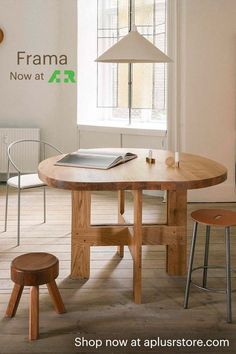 a wooden table sitting in front of a window