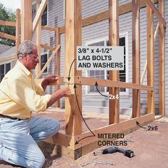 a man is working on the side of a house that has siding and nails attached to it