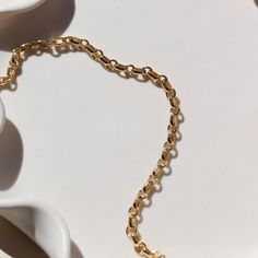 Picture a sleek and elegant gold bracelet, designed with minimalism in mind. It features a delicate chain crafted from shimmering 14k gold fill, offering a subtle yet luxurious glow. This piece embodies sophistication and refinement, perfect for adding a touch of timeless elegance to any ensemble. DETAILS14k gold fill Hypoallergenic, water proof, and nickel free To determine your wrist size, use a tape measure or ribbon around your wrist, then measure against a ruler. Elegant 14k Gold Bracelet With Cable Chain, Dainty 14k Gold Link Bracelet, Minimalist Gold-tone Paperclip Bracelet With Oval Links, Dainty 14k Gold Filled Adjustable Chain Bracelet, Dainty Oval Link Yellow Gold Bracelets, Everyday 14k Gold Delicate Chain Bracelet, Dainty Yellow Gold Link Bracelets, Dainty 14k Gold Bracelet With Gold Chain, Minimalist Yellow Gold Oval Link Bracelet