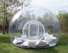 an inflatable bubble bed is sitting on the grass