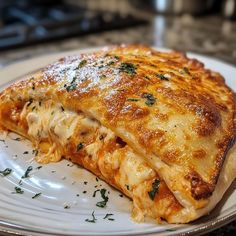 a white plate topped with lasagna covered in cheese