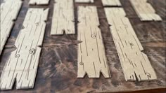 several pieces of wood cut out to look like wooden planks on a table top