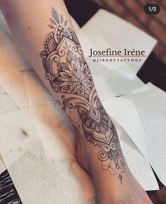 a woman's leg with a tattoo on it, and the words joscfinie irne written in black ink