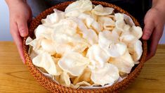 a person holding a bowl full of food