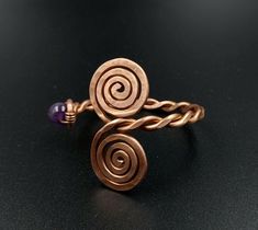 This is an adjustable, massive bracelet made of raw and pure copper with natural amethyst. Small, adjustable circumference: 16-20 cm Dacian inspiration. It can be made to order, any size. Wearing copper jewelry can leave greenish marks on the skin, that can be cleaned with soap and water. Wearing copper jewelry can stimulate healing, especially due to its ability to balance polarities or, in other words, the flow of projective and receptive energies. Nowadays, jewelry and ornaments made of pure copper are worn for healing and to prevent illness, with this therapy being called cuprotherapy. The health benefits of copper include better functioning of the body and improved health of connective tissues, hair, and eyes. It regulates the heart rate, balances the thyroid gland's function, acceler Adjustable Spiral Copper Bracelets, Adjustable Spiral Copper Bracelet, Adjustable Copper Spiral Bracelet, Adjustable Spiral Bronze Jewelry, Adjustable Bronze Spiral Jewelry, Adjustable Copper Bracelets For Healing, Adjustable Electroformed Purple Jewelry, Adjustable Purple Electroformed Jewelry, Wire Wrapped Jewelry Diy