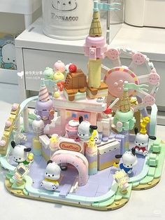 a toy carousel with hello kitty figures on it