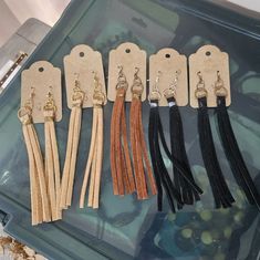 six pairs of leather tassels are on display