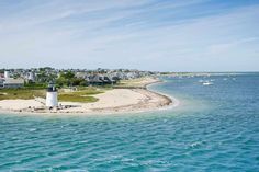 an island with a light house in the middle