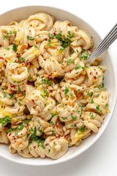 a white bowl filled with macaroni and cheese