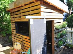 an outdoor kitchen made out of pallet wood